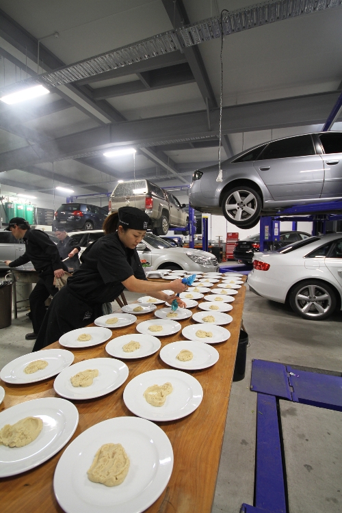 The Flying Trestles team on location in the Queenstown Motor Group workshop